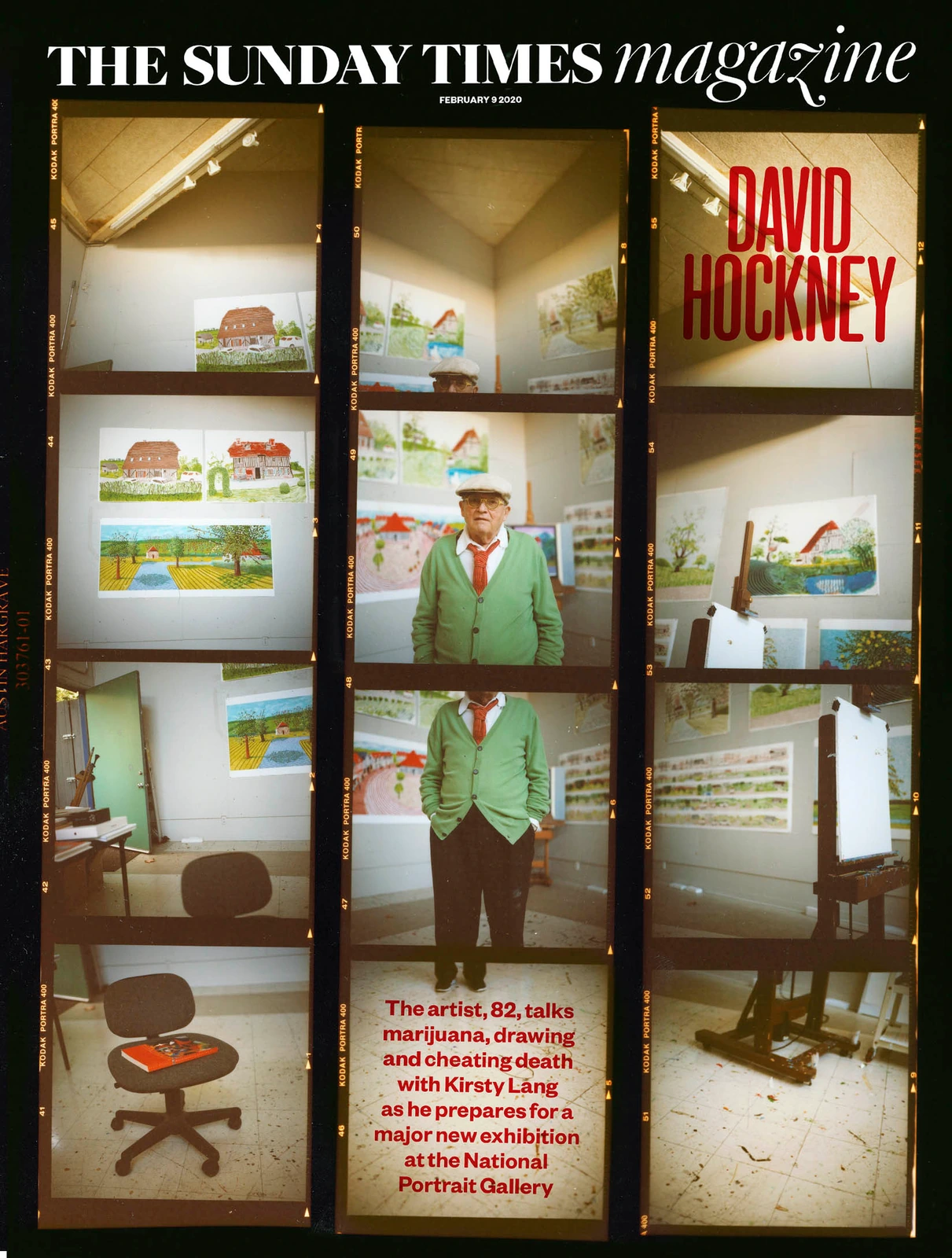 Artist David Hockney in a green cardigan and red tie amid his paintings, shot on film for The Sunday Times Magazine cover.