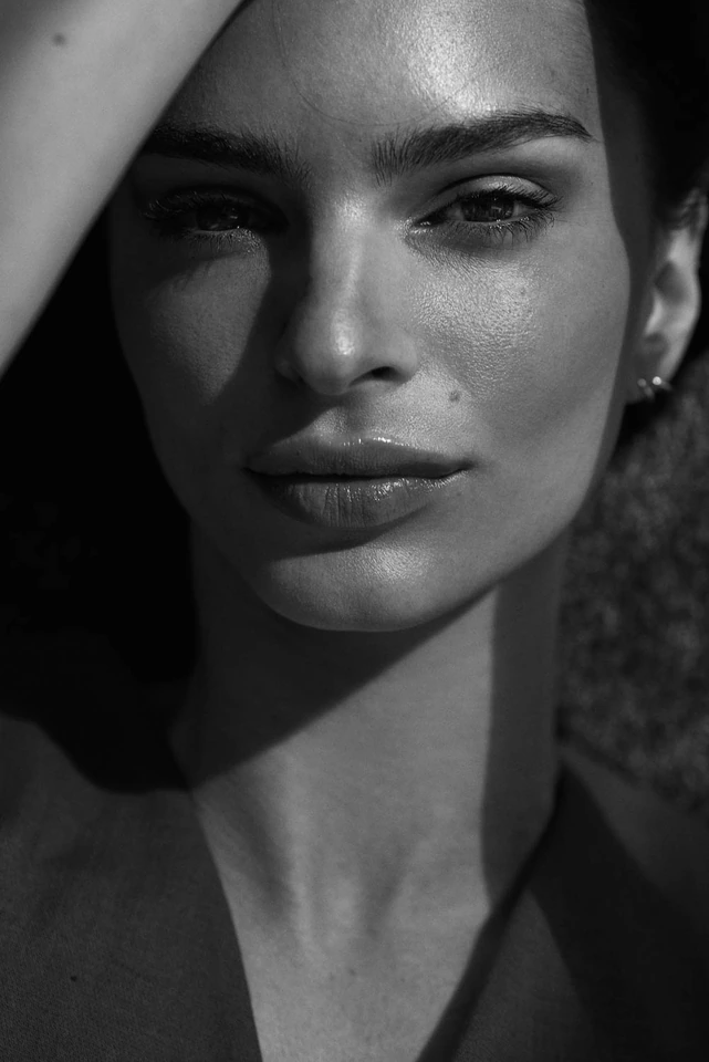 Model and actress Emily Ratajkowski, close black-and-white portrait, raking light across her face, by Austin Hargrave