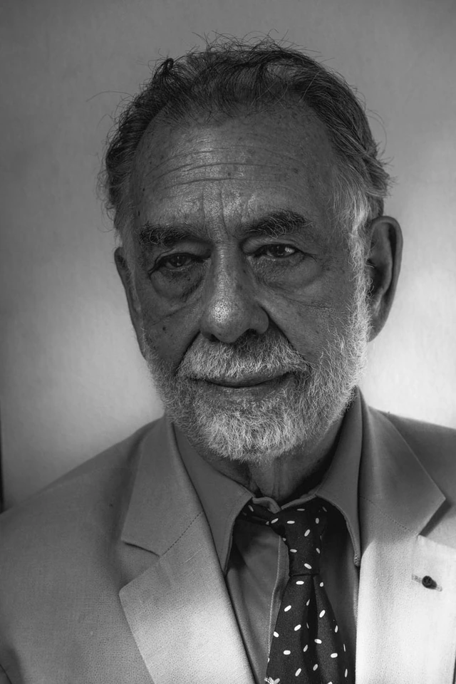 Director Francis Ford Coppola in black and white, steady gaze and a faint smile, light blazer and polka-dot tie, for WSJ.