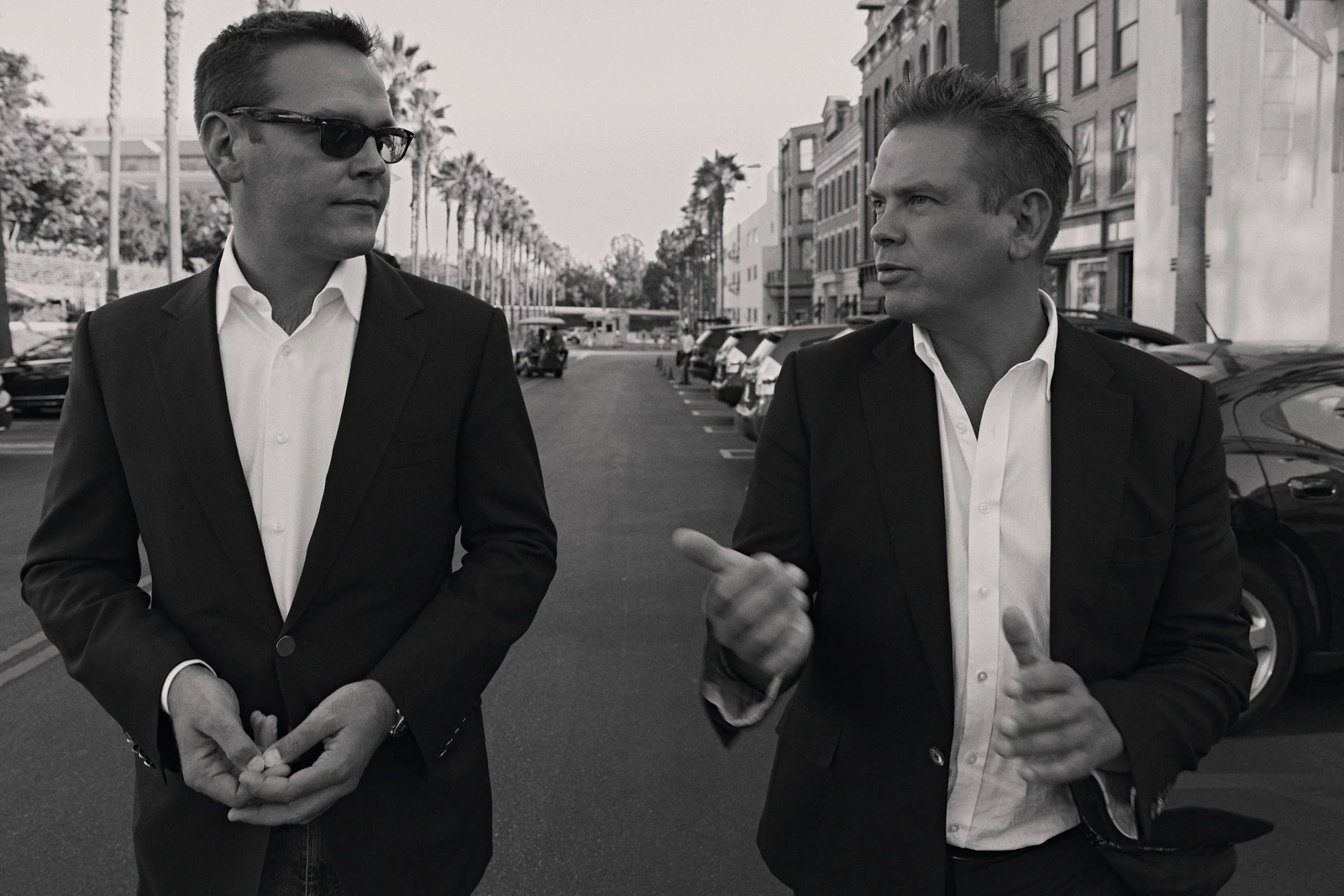 Media heirs Lachlan and James Murdoch mid-conversation on Fox backlot Los Angeles, photographed by Austin Hargrave