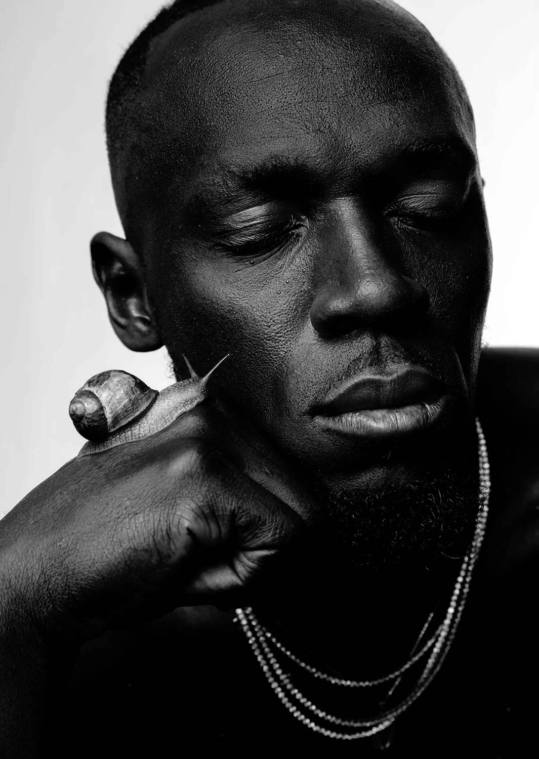 Usain Bolt photographed with snail by Austin Hargrave